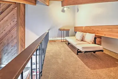 a living room with a couch and a railing at Northstar Resort Shuttle Access Truckee Condo in Truckee