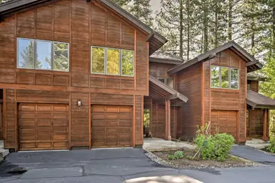 a house with wooden garage doors on a street at Forest-View Gem 2 Mi to Diamond Peak Ski Resort! in Incline Village