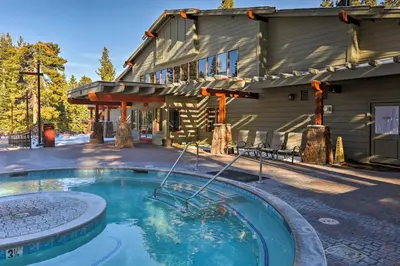a swimming pool in front of a house with a building at Family-Friendly Truckee Cabin Near Ski Shuttle! in Truckee