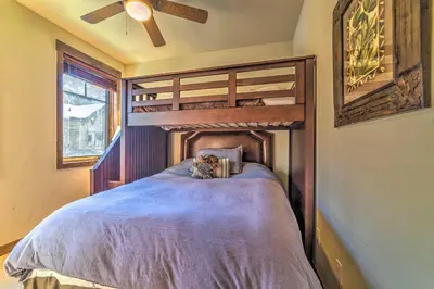 a bedroom with a wooden bunk bed in a room at Central Mammoth Lakes Townhome about 1 Mi to Slopes in Mammoth Lakes