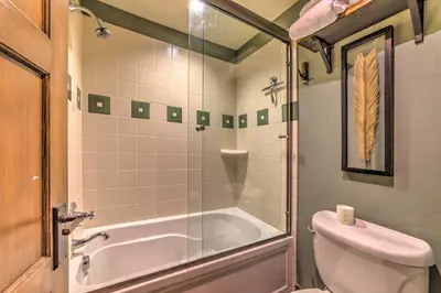 a bathroom with a tub and a toilet and a sink at Central Mammoth Lakes Townhome about 1 Mi to Slopes in Mammoth Lakes