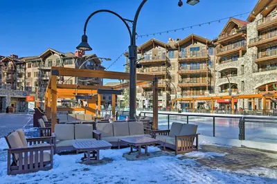 a gazebo with chairs and tables in the snow at Walk to Ski Shuttle Truckee Condo with Hot Tub in Truckee