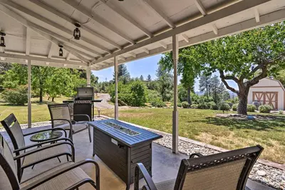 a patio with chairs and a table and a grill at Historic Mariposa Stagecoach Stop with Gas Fire Pit! in Mariposa