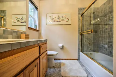 a bathroom with a toilet and a glass shower at Hot Tub Access, Near Skiing Tahoe Donner Cabin in Truckee