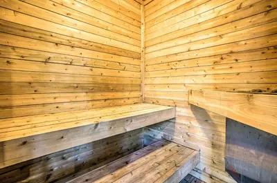 a wooden sauna with two wooden benches in it at Hot Tub, Indoor Pool! Home 8 Mi to Heavenly Skiing in South Lake Tahoe