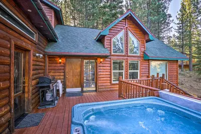a log cabin with a swimming pool on a deck at Hot Tub, Indoor Pool! Home 8 Mi to Heavenly Skiing in South Lake Tahoe
