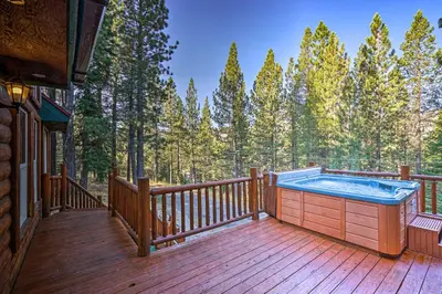 a hot tub on the deck of a cabin at Hot Tub, Indoor Pool! Home 8 Mi to Heavenly Skiing in South Lake Tahoe