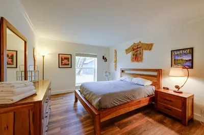 a bedroom with a bed and a mirror at 7 Mi to Bass Lake! Spacious Mudge Ranch Retreat in Coarsegold