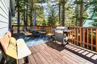 a grill on a deck with a table and chairs at Less Than 15 Mi to 6 Ski Resorts Tahoe Donner Escape! in Truckee