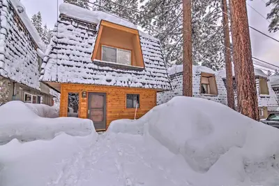 a house with a pile of snow in front of it at Private Deck and Community Pool Incline Village Gem in Incline Village