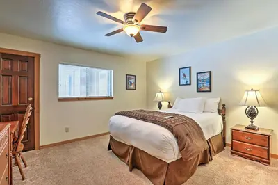 a bedroom with a bed and a ceiling fan at Rustic Truckee Lodge with Rec Room - Near Northstar! in Truckee