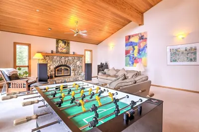 a living room with a large pool table at Mtn and Lake Views Incline Village Ski Chalet in Incline Village