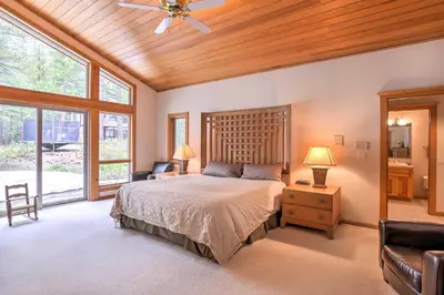 a bedroom with a bed and a wooden ceiling at Mtn and Lake Views Incline Village Ski Chalet in Incline Village