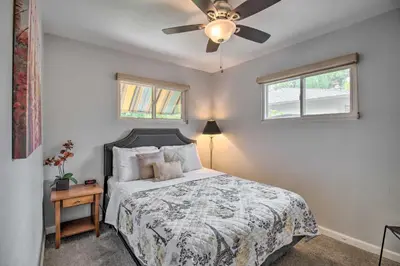 a bedroom with a bed and a ceiling fan at Ski, Hike and Unwind Cozy Carson City Duplex! in Carson City