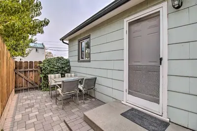 a patio with a table and chairs next to a house at Ski, Hike and Unwind Cozy Carson City Duplex! in Carson City