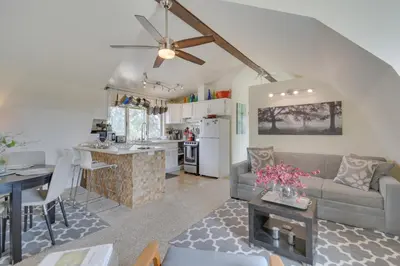 a living room and kitchen with a couch and a table at Mariposa Home Furnished Patio and Sierra Mtn Views in Mariposa