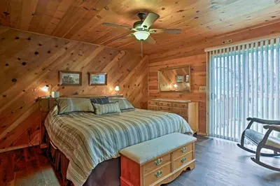 a bedroom with a bed and a ceiling fan at Cozy Home with Patio Near Yosemite National Park! in Mariposa