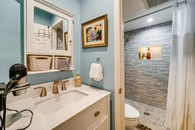 a bathroom with a sink and a shower and a toilet at 1 Mi to Diamond Peak Ski Resort Condo with Pool in Incline Village