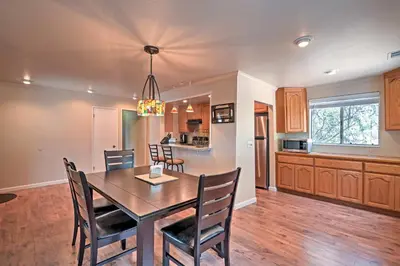 a dining room and kitchen with a table and chairs at Remodeled and Cozy Gilroy Guest House Near Downtown! in Gilroy