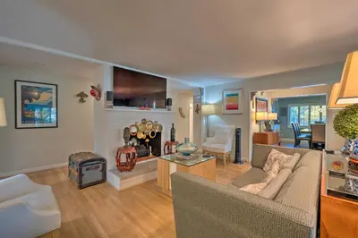 a living room with a couch and a fireplace at Spacious Wine Country Home 1 Mi to Downtown Lodi! in Lodi