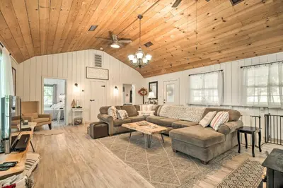 a living room with a couch and a table at Strawberry Hill Cabin 5 Mi to Skiing and Lake in Strawberry