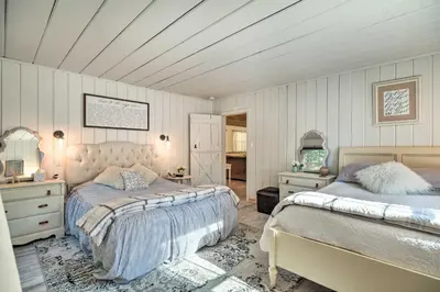 two beds in a bedroom with white walls at Strawberry Hill Cabin 5 Mi to Skiing and Lake in Strawberry