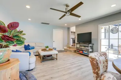 a living room with a couch and a tv at Family Home with Pool about 7 Mi to Downtown Sacramento! in Sacramento