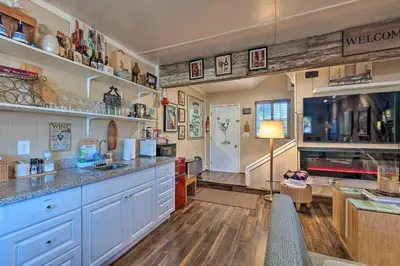 a kitchen with blue cabinets and a counter top at Luxurious Downtown Lodi Apartment in Wine Country! in Lodi