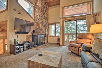 a living room with a couch and a tv at The Mammoth Lodge by Hiking, Lakes, Skiing and More! in Mammoth Lakes