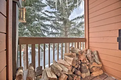 a pile of fire wood on a balcony at The Mammoth Lodge by Hiking, Lakes, Skiing and More! in Mammoth Lakes