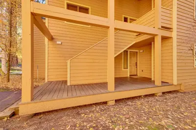 a porch of a house with a wooden deck at 2 Mi to Diamond Peak! Corner-Unit Condo with Hot Tub in Incline Village