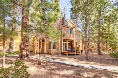 a log cabin in the woods with trees at 2 Mi to Diamond Peak! Corner-Unit Condo with Hot Tub in Incline Village