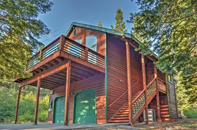a wooden house with a wrap around deck at Forest Views and Beach Access Family Truckee Gem in Truckee