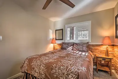 a bedroom with a bed and two lamps and a window at Close to Donner Lake and Skiing Truckee Getaway in Truckee