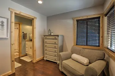 a living room with a chair and a dresser at 5 Mi to Skiing! Family Getaway Near Donner Lake in Truckee