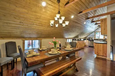 a dining room with a table and a kitchen at 5 Mi to Skiing! Family Getaway Near Donner Lake in Truckee