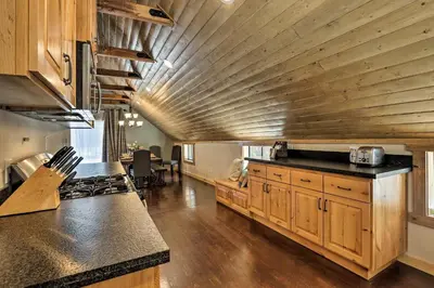 a kitchen with wooden cabinets and a wooden ceiling at 5 Mi to Skiing! Family Getaway Near Donner Lake in Truckee