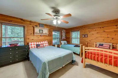 a bedroom with two beds and a ceiling fan at 11 Mi to Apple Hill Pollock Pines Resort Cabin in Pollock Pines