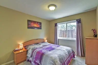 a bedroom with a bed and a window at Waterfront Discovery Bay Home Outdoor Bar and Dock in Discovery Bay