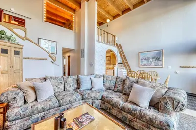 a living room with a couch and a table at Heavenly View 4 U in Stateline