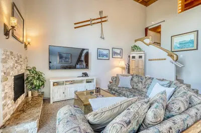 a living room with a couch and a tv at Heavenly View 4 U in Stateline