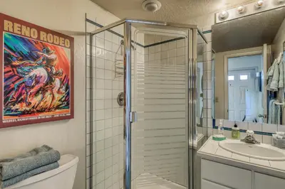a bathroom with a shower and a toilet and a sink at Spike's Place in Truckee