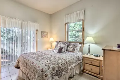 a bedroom with a bed and a window at Carnelian Bay Home with Hot Tub Near Tahoe Skiing in Carnelian Bay