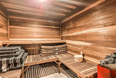 a sauna with a bench and a suitcase in it at Lake Tahoe Family Home with Hot Tub and Game Room! in Incline Village