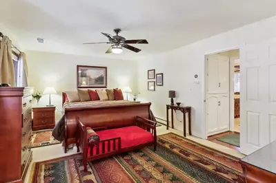 a bedroom with a bed and a ceiling fan at Lake Tahoe Family Home with Hot Tub and Game Room! in Incline Village
