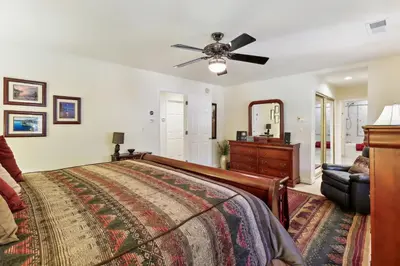 a bedroom with a bed and a ceiling fan at Lake Tahoe Family Home with Hot Tub and Game Room! in Incline Village
