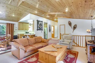 a living room with a couch and a table at 7 Mi to Northstar Resort Tahoe Vista Family Cabin in Tahoe Vista