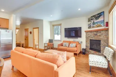a living room with a couch and a fireplace at 4 Mi to Skiing Truckee Escape with Deck in Truckee