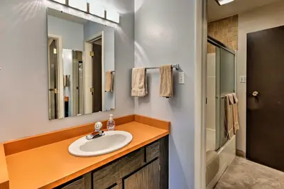 a bathroom with a sink and a mirror at Ski Condo with Beach Access and 2 Mi to Diamond Peak! in Incline Village