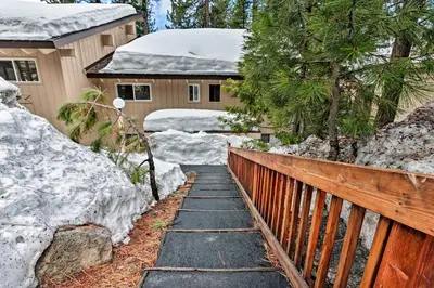 a walkway in front of a house with snow at Ski Condo with Beach Access and 2 Mi to Diamond Peak! in Incline Village